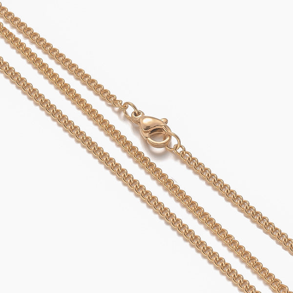 Close up image of a 2mm gold curb chain necklace