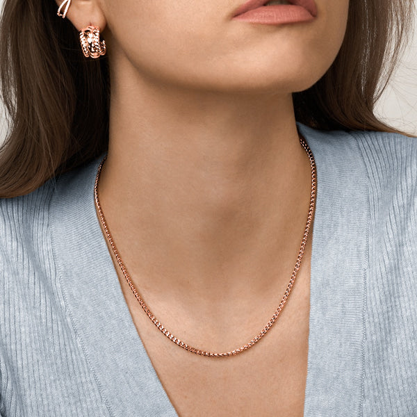 Woman wearing a 3mm rose gold curb chain necklace
