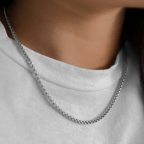 Woman wearing a 3mm silver wheat chain necklace