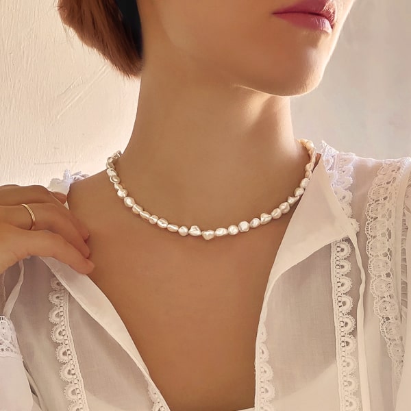 6-7mm baroque freshwater pearl necklace on woman's neck