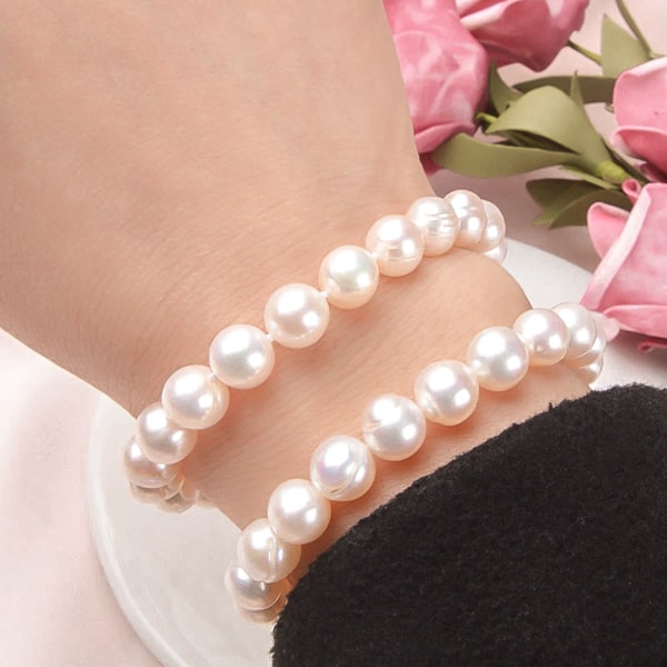8mm pearl bracelet on a woman's wrist