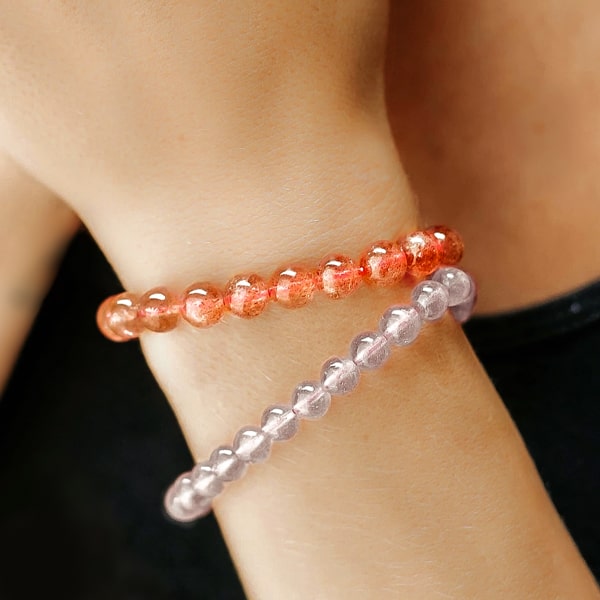 Beaded Gold Strawberry Quartz bracelet on a woman's wrist