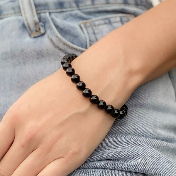 Beaded black tourmaline bracelet on a woman's wrist