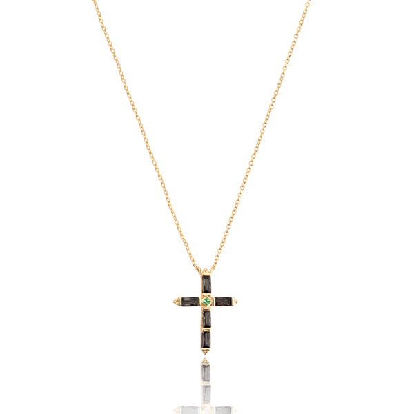 Black crystal cross on a gold necklace