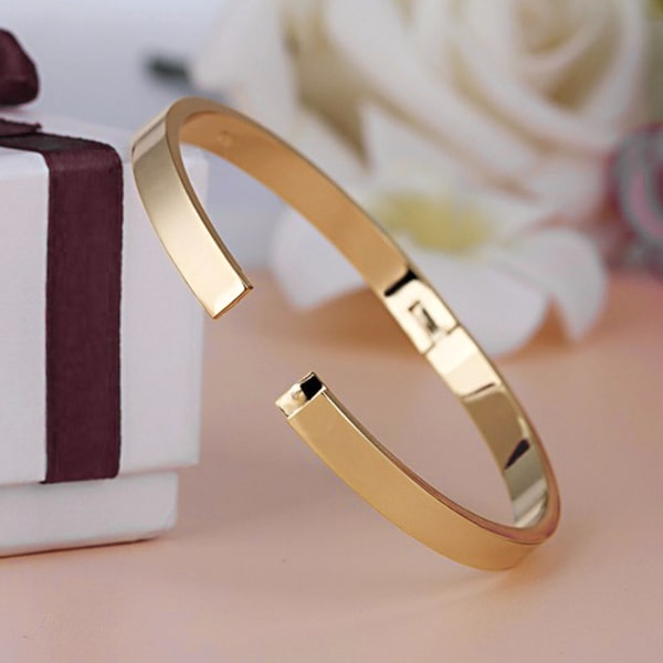 A 6mm gold bangle bracelet made of waterproof hypoallergenic stainless steel