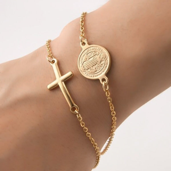 Woman wearing a gold cross bracelet