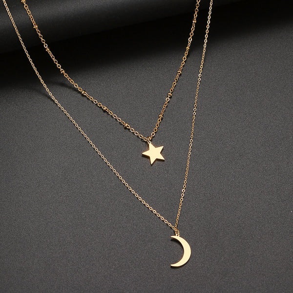 Gold layered star and moon necklace details