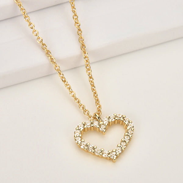 Champagne crystal open heart on a gold necklace display