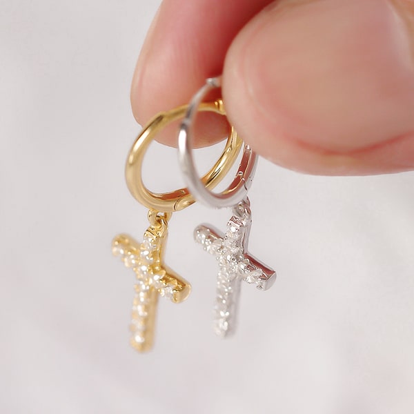 Gold cross hoop earrings detail