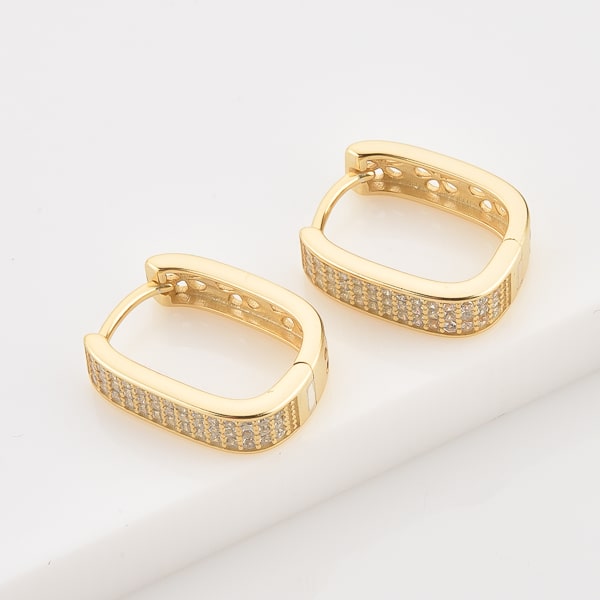 Gold crystal pavé oval hoop earrings details
