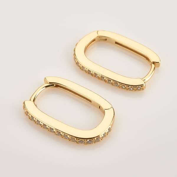 Details of the gold oval crystal hoop earrings