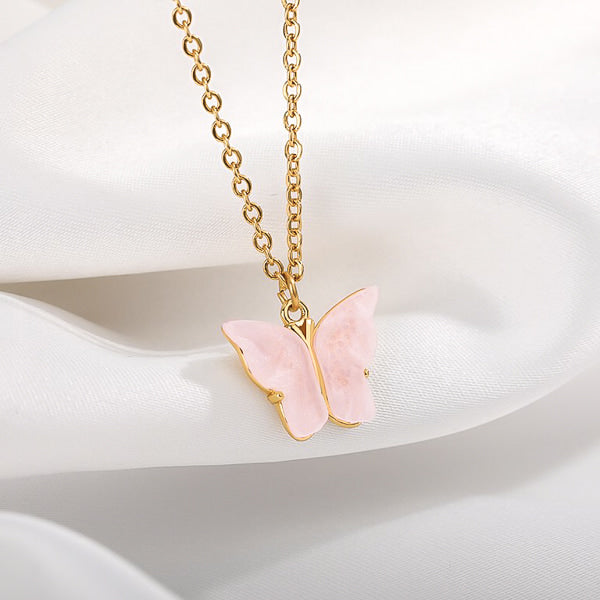 Gold rose butterfly pendant necklace display