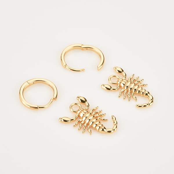 Gold scorpion hoop earrings details