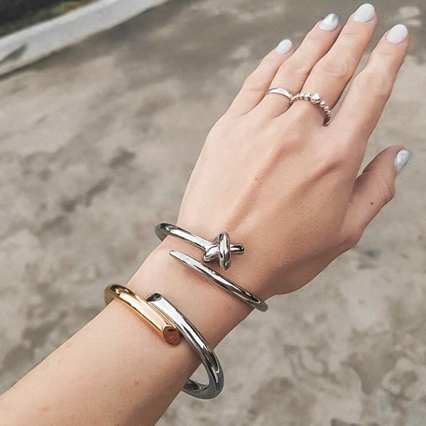 Gold & silver harmony cuff bracelet displayed on a woman's wrist
