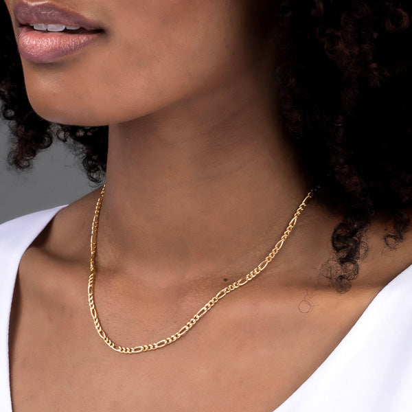 Woman wearing gold vermeil figaro chain necklace