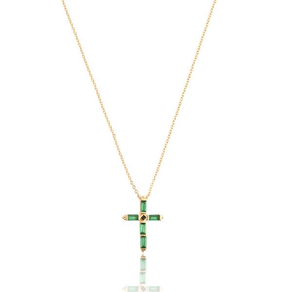 Green crystal cross on a gold necklace