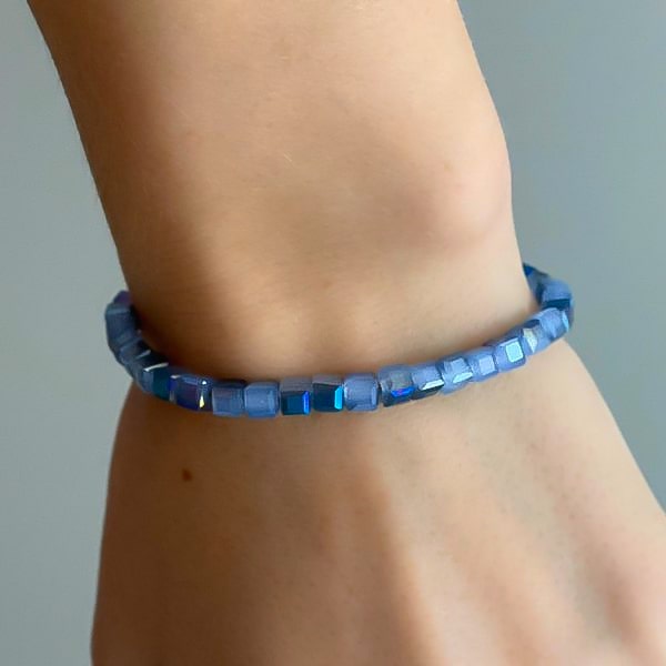 Woman wearing a lavender blue square crystal bracelet