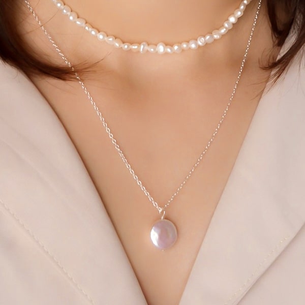 Layered freshwater pearl necklace set on a woman's neck