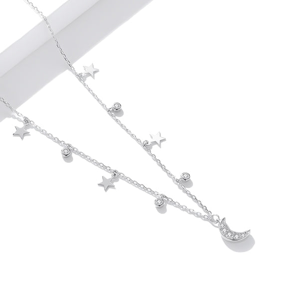 Details of the crescent moon and star necklace inspired by the night sky