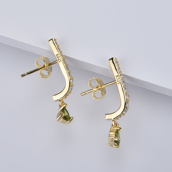 Gold curved bar earrings with olive green teardrop charm