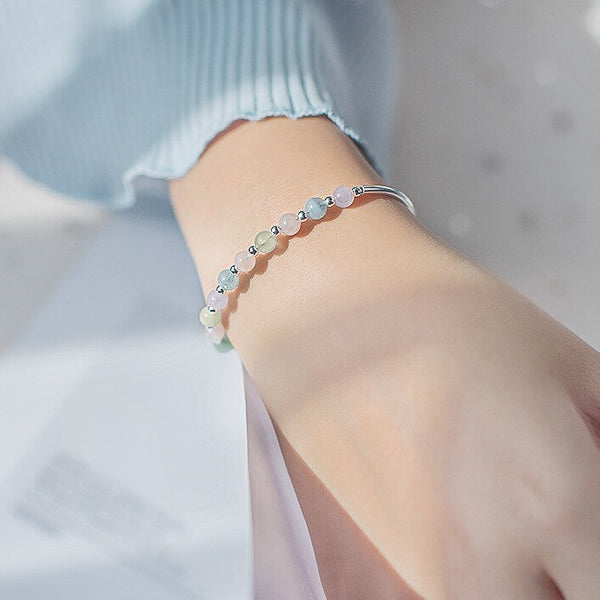 Pastel crystal bead bangle bracelet on woman's wrist