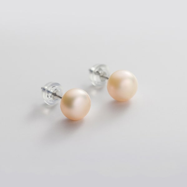 Large pink pearl stud earrings details