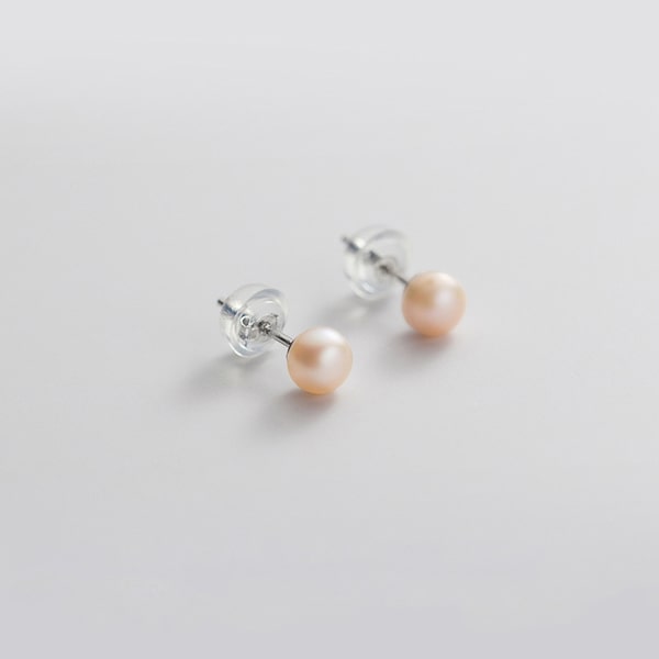 Small pink pearl stud earrings details