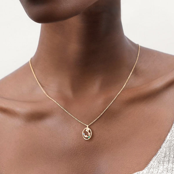 Woman wearing Pisces constellation necklace