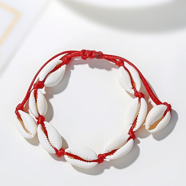 Red cowrie shell ankle bracelet detailed close up