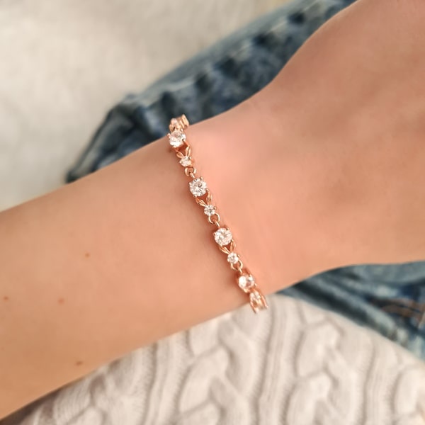 Woman wearing a rose gold crystal chain bracelet