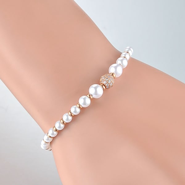 Rose gold crystal pearl bracelet on woman's wrist