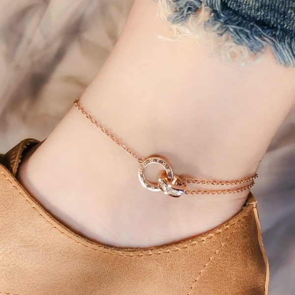 Rose gold crystal roman numeral anklet on an ankle