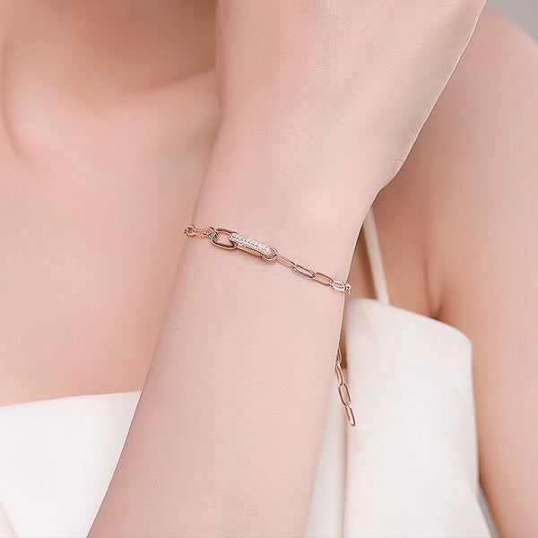 Rose gold luxury link chain bracelet on woman's wrist