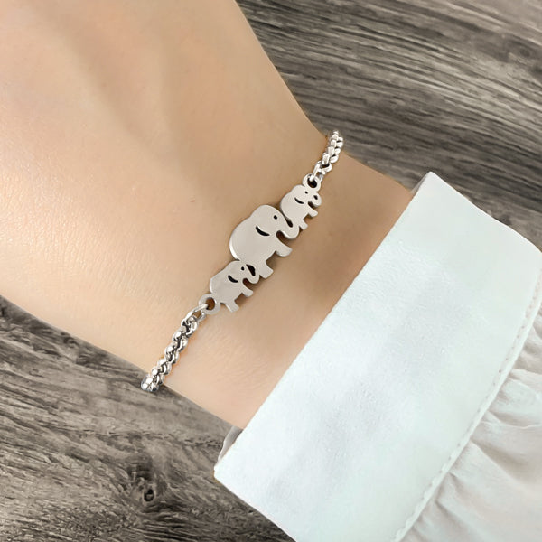 Woman wearing a silver elephant family bracelet