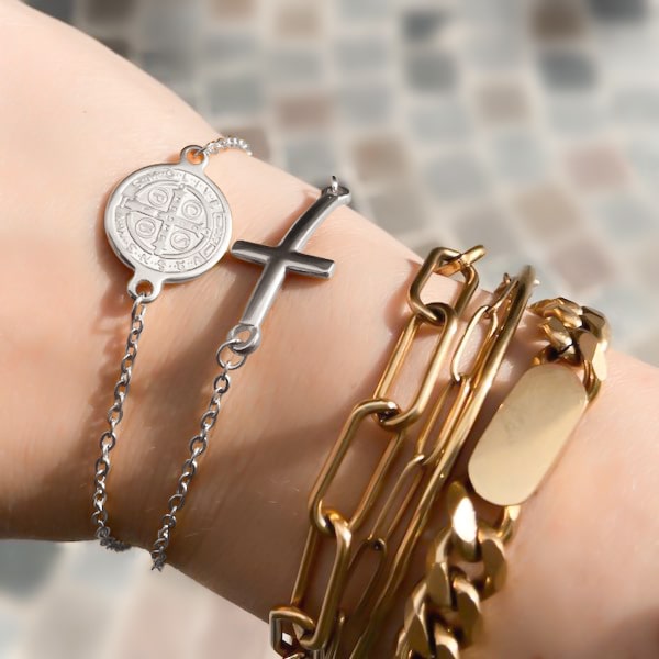 Woman wearing a silver Saint Benedict bracelet