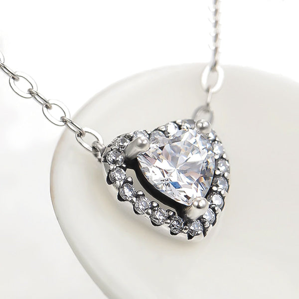 Crystal halo heart on a silver necklace display