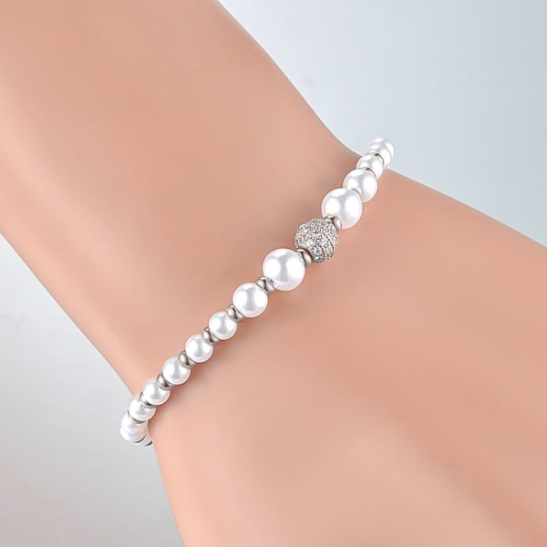 Silver crystal pearl bracelet on woman's wrist