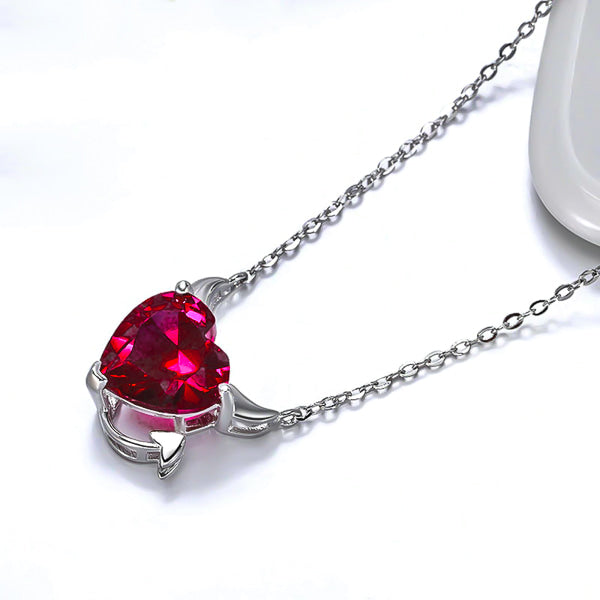 Red crystal devil heart on a silver necklace display