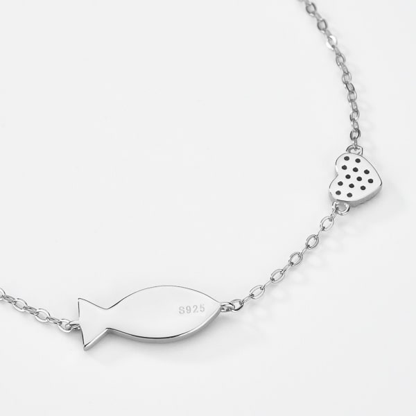 Sterling silver fish bracelet close up