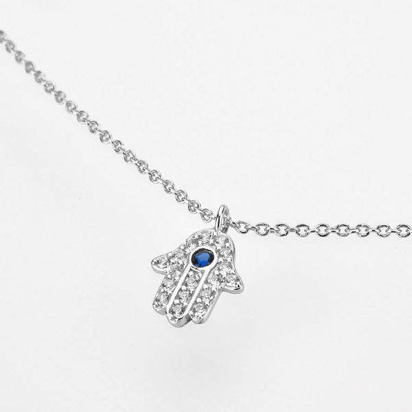 Silver hamsa necklace display