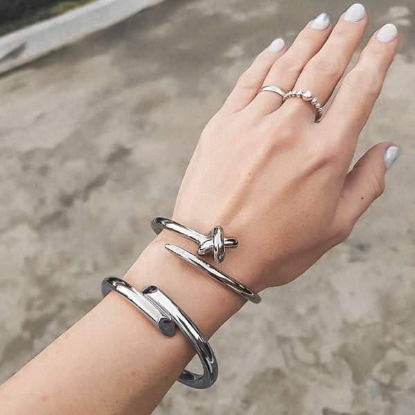 Silver harmony cuff bracelet on a woman's wrist