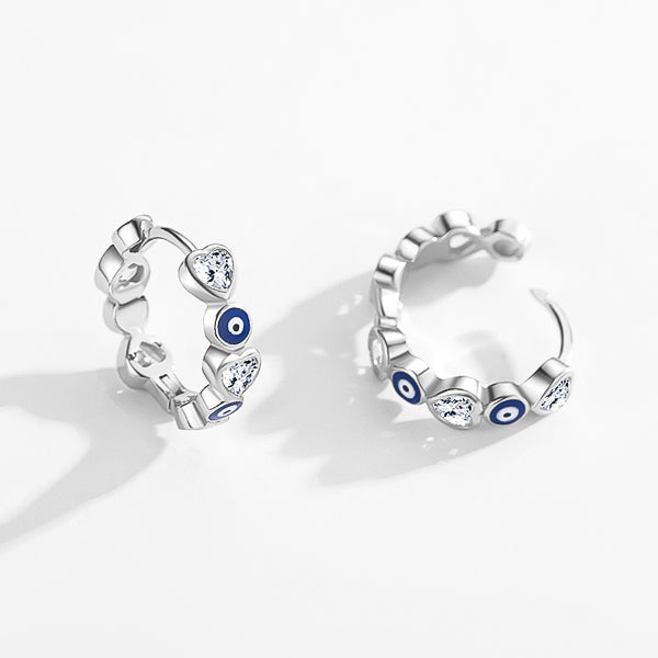 Small sterling silver evil eye hoop earrings with heart-shaped crystals