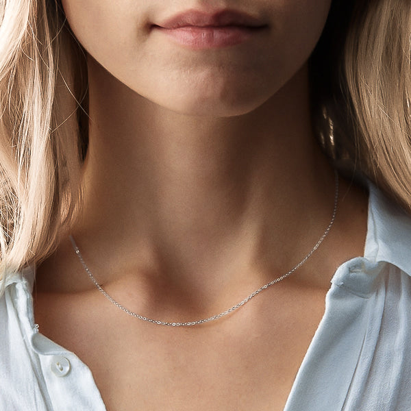 Woman wearing sterling silver cable chain necklace