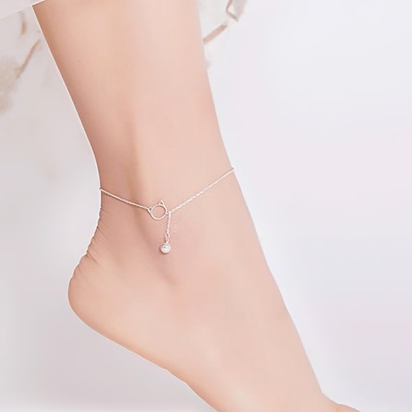 Silver cat anklet on a womans ankle