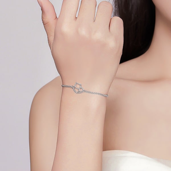 Sterling silver cat bracelet on a woman's arm
