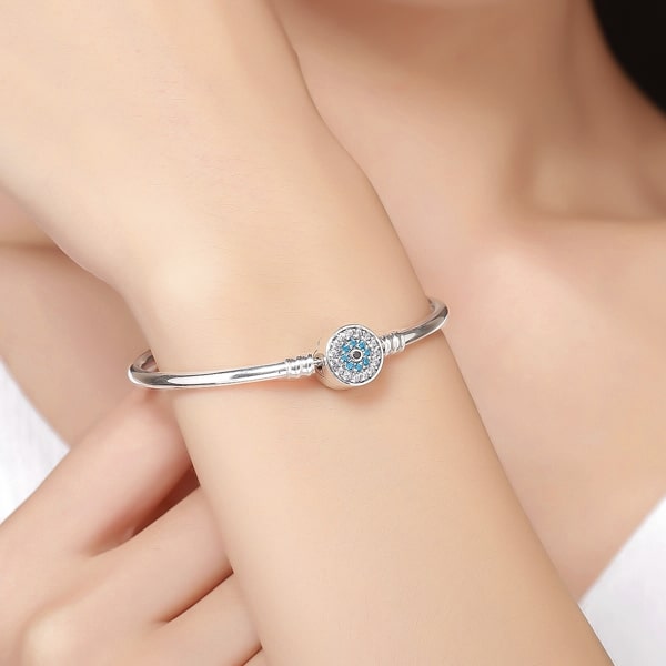 Sterling silver crystal eye bracelet on a woman's wrist