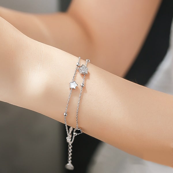 Sterling silver night stars bracelet on a woman's wrist