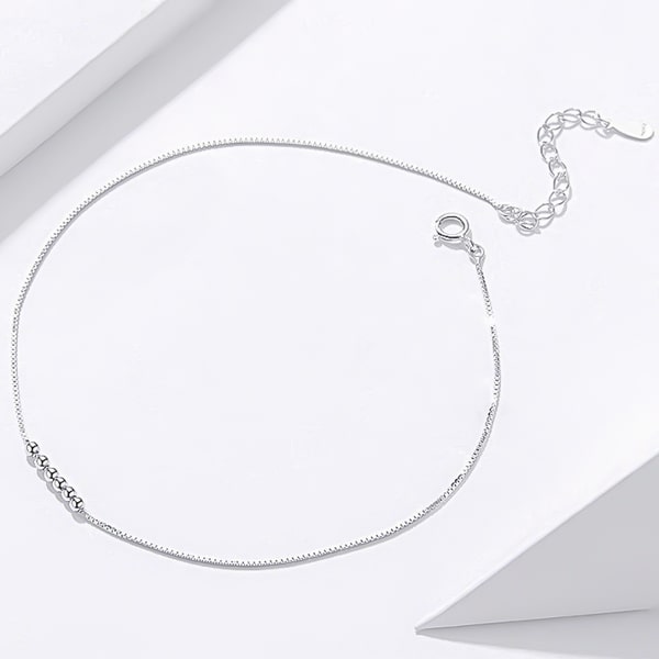 Details of the silver small bead ankle bracelet