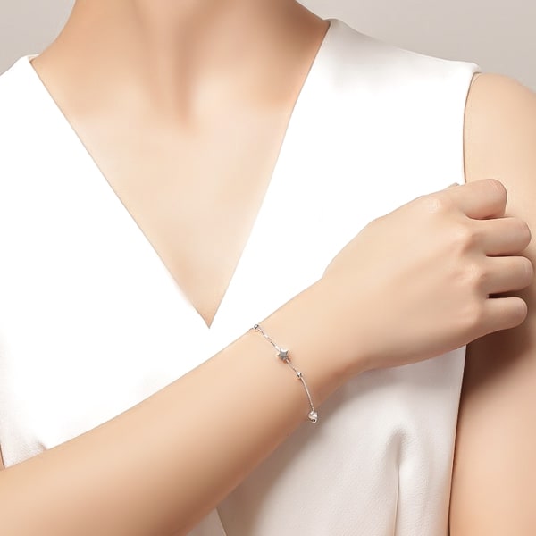 Sterling silver star bracelet on a woman's wrist