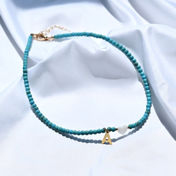 Turquoise beaded choker necklace with gold initial letter charm pendant